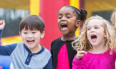 Children singing and smiling