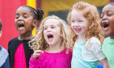 Kids singing and smiling