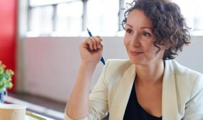 Woman in a meeting setting. 