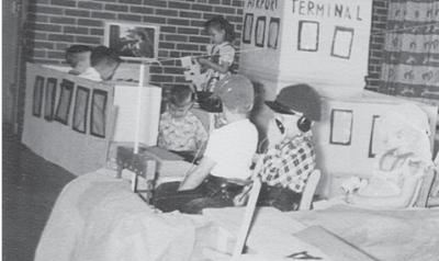 an old photo of children playing in a craft airplane