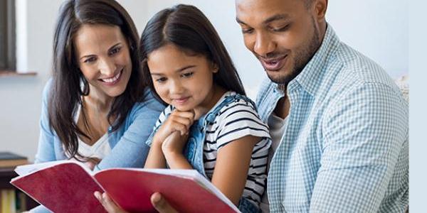 family of 3 reading a book