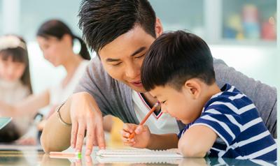 Child writing on paper