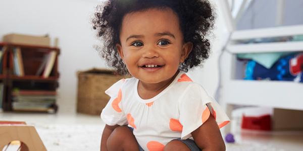 Little girl playing in play room