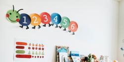 a paper caterpillar wall decoration in classroom