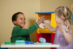 two children high fiving