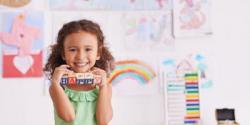 preschool girl holding blocks