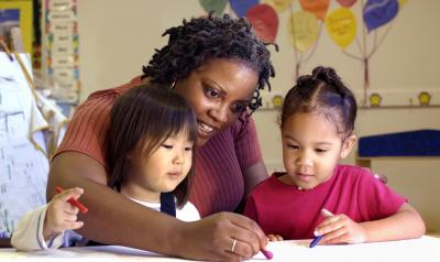 Teacher working with students