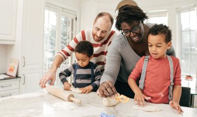 Parents helping children in the kitchen