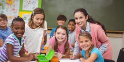 A teacher with a group of young children.