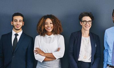 Group of professional in a room smiling