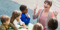 a teacher having fun with young students