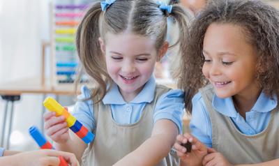 Children building with LEGOs