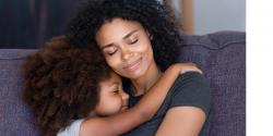 Mother and daughter hugging