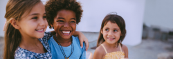 Three children smiling