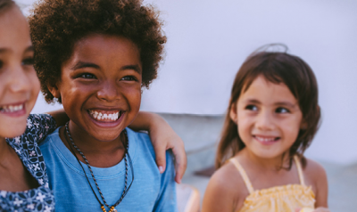 Three children smiling