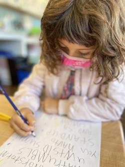 A child writes a poem.