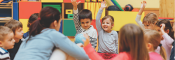 Preschool children in circle in classroom