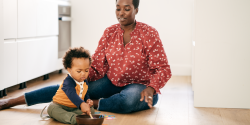 a teacher supervising a child playing