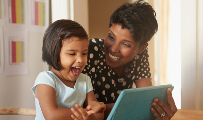 Mother and daughter with ipad/tablet