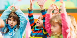 children with their hands in the air